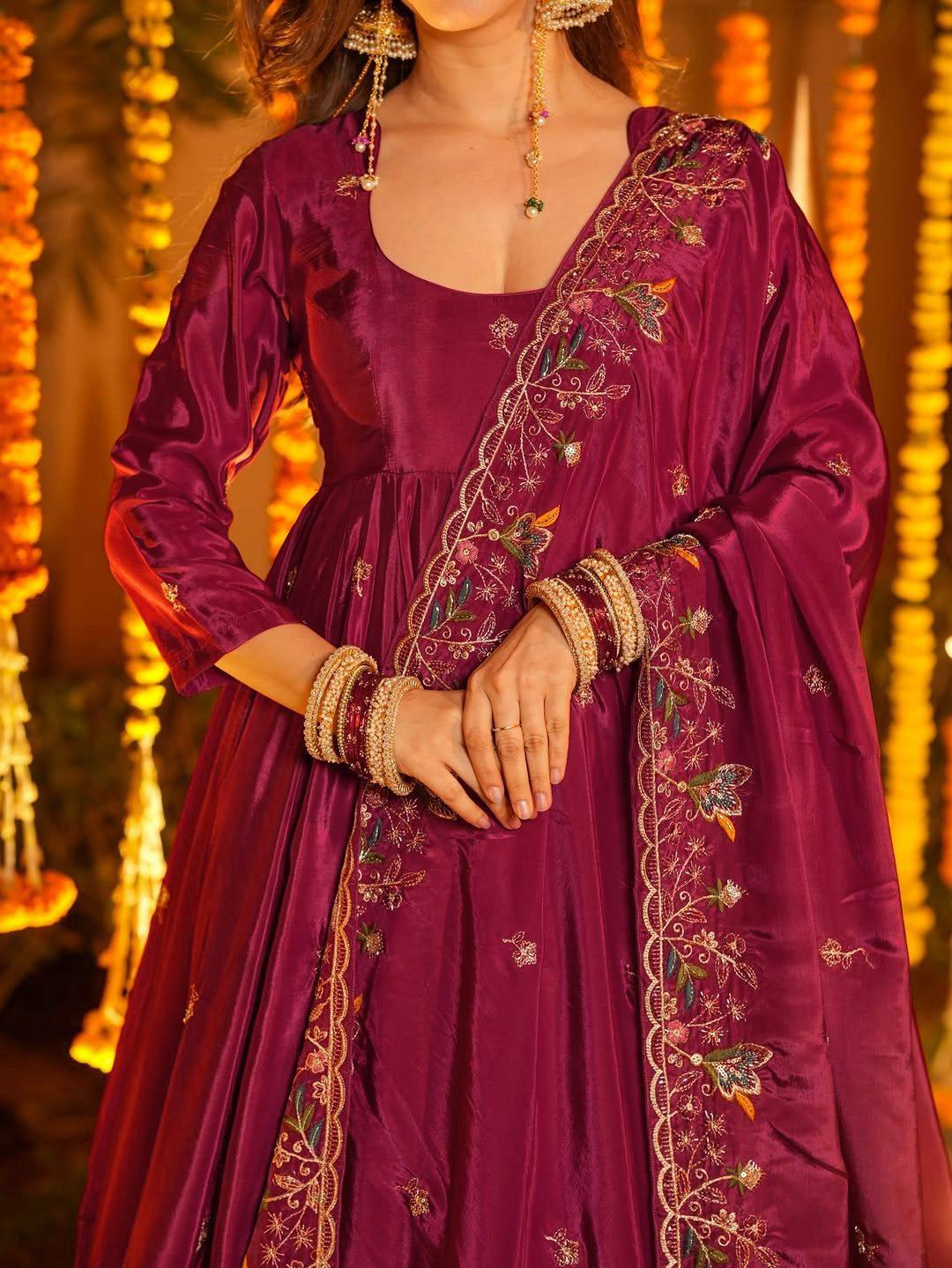 Closeup of sequin and thread embroidery work on crepe silk Anarkali fabric
