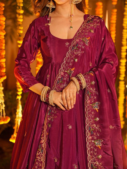 Closeup of sequin and thread embroidery work on crepe silk Anarkali fabric