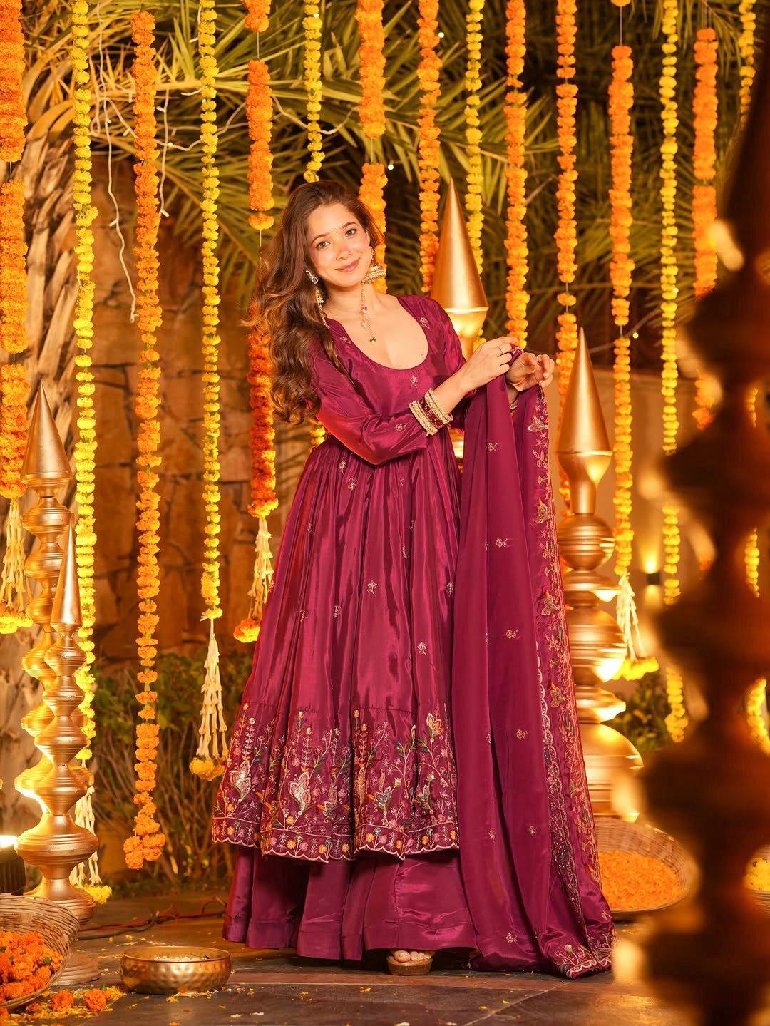 Side view of maroon party wear Anarkali with flowy flare and full sleeves