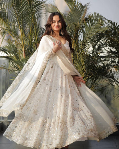 White embroidered Anarkali gown front view with full flair and dupatta